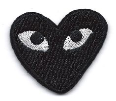 a black heart with two eyes on it