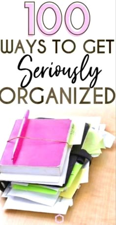 a pile of notebooks with the words, 100 ways to get seriously organized