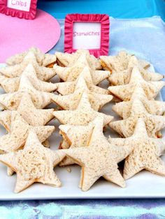 star shaped cookies are arranged on a plate