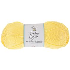 a skein of yellow yarn with the words baby bug on it in white lettering