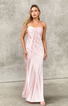 Light Pink Strapless Maxi Dress

How to style:
Take a formal () occasion to the next level in the luxe satin strapless maxi dress (). This thick baby pink material is stunning - you'll be radiating all night long. Pair with kitten heels and dainty jewellery () as the finishing touch.

Features:
  
 * Maxi length 
 * Strapless style  
 * Inner bust gripping 
 * Sweetheart neckline 
 * Fully lined 
 * Slight stretch 
 * Invisible left side zip closure 
 * Centre bust gathering 
 * Ribbon draping feature at centre bust  
Please note: Ribbon feature can either be left or tied in bow for a femme touch! Prom Dresses Light Pink, Light Pink Bridesmaids Dresses, Light Pink Formal Dress, Bridesmaids Pink, Light Pink Bridesmaid Dresses, Dainty Jewellery, Prom Midi Dress, Quince Dress, Hoco Dress