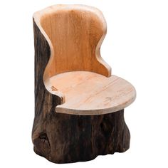 a wooden chair sitting on top of a tree stump