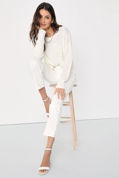 Grace everyone with your good energy in the Lulus Positive Presence Ivory Loose Knit Sweater! Medium-gauge loose knit shapes this must-have pullover sweater that has a rounded neckline, long sleeves with drop shoulders, and a relaxed-fit bodice. Notched hem creates a high-low effect for a stylish finishing touch! Fit: This garment fits true to size. Length: Size medium measures 23.5" from shoulder to hem. Bust: Great for any cup size. Waist: Not Fitted - comfortable room throughout midsection. U Versatile White Long Sleeve Knit Top, White Long Sleeve Versatile Knit Top, Chic Winter White Sweater With Relaxed Fit, Versatile White Long Sleeve Sweater, Versatile White Long-sleeved Sweater, White Textured Knit Top For Workwear, White Textured Knit Top For Work, Chic Relaxed Fit Cream Sweater, Chic White Sweater For Workwear