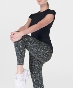 Our outdoor workout leggings with extra compression and an updated fit. Heavier-weighted Power fabric is sweat-wicking, breathable and 95% squat-proof, with high compression for maximum support. New waistband with a high rise fit and internal adjustable drawcord. Features five pockets - two slip pockets on each side and one back zipped pocket. Reflective details and updated Sweaty Betty wordmark on the ankle and waistband. Inseam length: 60cm / 24". Model wears size S and is 178cm/5'10" tall. Style Code: SB10029A78Colour: Green Micro Leopard Print Outdoor Workout, Running Leggings, Sweaty Betty, Gym Leggings, Squat Proof, Outdoor Workouts, Vest Top, Yoga Clothes, Workout Leggings