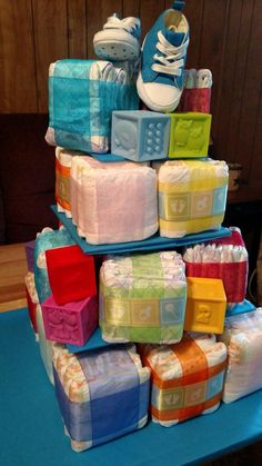 a stack of baby diapers and shoes on top of each other