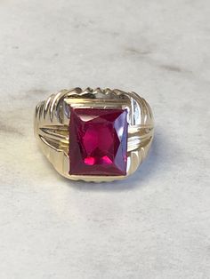 A Classic Mens 14kt Yellow Gold Mens Red Spinel Octagon Shape bezel set in fashion style ring. Finger size 8. total weight is 7.5 grams. This item would Retail for $895.00 Red Spinel, Octagon Shape, Ring Finger, Bezel Setting, Rings Statement, In Fashion, Statement Rings, Heart Ring, Rings For Men