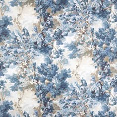 a blue and white floral wallpaper with lots of leaves on the top of it