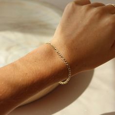 Our newest obsession–– Whether we're heading to the beach or a cocktail party in a little black dress, the Gigi Bracelet is one that we'll never take off. DETAILS 14k Gold Fill or Sterling Silver chain measures 3.5mm with Lobster Clasp embellished with a little labradorite gemstone. // Sizing: X-Small = 5.5"; Small = 6"; Medium = 6.5", Large = 7"; X-Large = 7.5"Each bracelet extends up to an additional .5"Hypoallergenic and water-proof * To find your size, wrap a piece of string around your wris 925 Sterling Silver Chain, Ring Size Guide, Custom Rings, Ring Necklace, Rose Gold Plates, Jewelry Care, Sterling Silver Chains, Anklets, Silver Chain