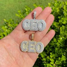 "Solid 925 sterling silver CEO pendant Be the Boss and wear this piece!! Super Iced out and very detailed. 3D effect 2\" wide...1\" tall (1.5\" w bale) Weighs about 26.5 grams Solid 925 sterling silver in either Rhodium Finish or 14k gold vermeil (two tone with silver letters) Iced with 4.5ct simulated diamonds (cz)...nice mix of natural & round stones Pendant only. Chains sold separately." Silver Cubic Zirconia Nameplate Jewelry, Silver Engraved Cubic Zirconia Jewelry, Engraved Silver Cubic Zirconia Jewelry, White Diamond Nameplate Jewelry, Classic Diamond Nameplate Jewelry, Personalized Sterling Silver Jewelry In Diamond White, Personalized Diamond White Sterling Silver Jewelry, Silver Nameplate Jewelry For Formal Occasion, White Engraved Cubic Zirconia Jewelry