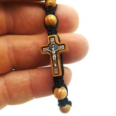 This beautiful bracelet is handmade in Medjugorje by a member of our family. Made using 10 olive wood beads, St Benedict cross in wood and Divine Mercy / Virgin Mary medal on closure.Adjustable sliding knot.9.5 inches (24 cm) when fully opened. Fits adults and teens a like.This bracelet is great gift for yourself or someone dear to you.Message card of Holy Lady from Medjugorje included. Also a free Medjugorje powers card with every multi item purchase.***NOTE: We also have Custom Gift Cards, all Adjustable Wooden Beads Rosary Bracelet Gift, Handmade Brown Rosary Bracelet As Gift, Adjustable Wooden Bead Rosary Bracelet Gift, Adjustable Cross Jewelry With Wooden Beads, Adjustable Wooden Beads Cross Jewelry, Blessing Bracelets, Jesus Bracelet, Adjustable Cord Bracelet, St Michael Medal