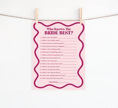 a pink sign hanging from a clothes line that says who knows the bride best?