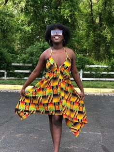 This kente Dress is gorgeous for the summer and very vibrant. Dress is halter style Has adjustable strings that tie to the neck and back Dress is high low style Material is light weight Very comfortable fit Strings can be tied at the shoulder or back Attention grabbing dress. Can be worn at the beach To parties and cook outs Yellow Halter Neck Sundress For Beach Season, Multicolor Backless Beachwear Dress, Yellow Tie Back Mini Dress For Beach, Multicolor Backless Sundress For The Beach, Multicolor Backless Sundress For Beach, Backless Multicolor Sundress For Beach, Yellow Tie Back Mini Dress For Vacation, Multicolor Halter Neck Beach Dress, Yellow Backless Mini Dress For Vacation