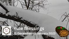 a snow covered tree branch with the words yule blessings on it and an image of