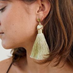 FINAL SALE Life is short. More is more. Introducing the Majors: an oversized, luxe version of our best-selling tassel earrings. These babies are begging to be worn on the dance floor or to a cocktail party. Metallic champagne thread shines in the light (or under a disco ball). They pack the punch of a big statement earring, without weighing down your ears. Featherlight and kinda fancy. Dress them up or down. Details: Featherlight polyester tassel. Thread is stiff and holds its shape well. 14 kar Gold Dangle Tassel Earrings For Summer, Summer Party Earrings With Latkans, Elegant Tassel Earrings For Party, Chic Dangle Tassel Earrings For Party, Summer Gold Tassel Earrings, Party Tassel Earrings With Fringe, Summer Party Jewelry With Latkans, Chic Summer Jewelry With Tassels, Gold Fringe Earrings For Summer