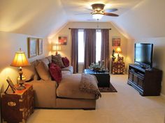 a living room filled with furniture and a flat screen tv