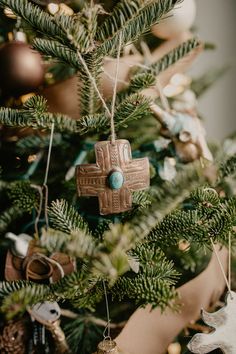 a christmas tree with ornaments hanging from it