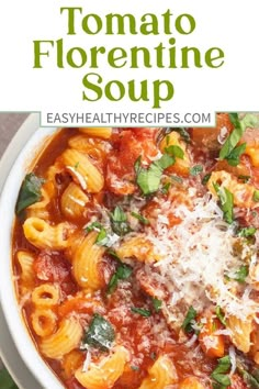 a white bowl filled with pasta and tomato sauce, topped with parmesan cheese