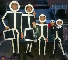 a group of people in costumes standing next to a car