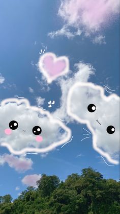 two clouds with faces drawn on them in the shape of heart shaped eyes and nose