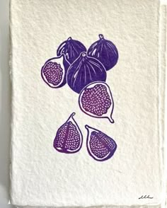 a piece of paper with an image of figs on it