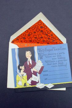 an orange and blue envelope with a cartoon character on the inside is open to reveal a letter