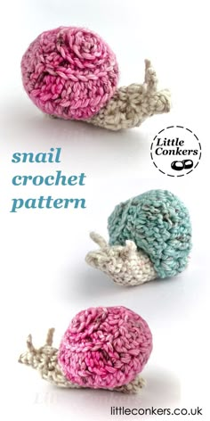 two crocheted snails sitting next to each other