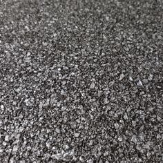 black and white photograph of an asphalt surface