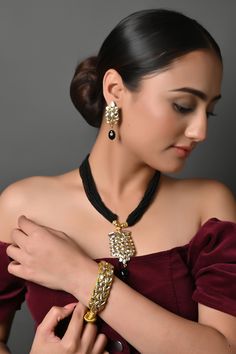 Black Seed Beads Kundan Necklace Set With Earrings & Kundan Bracelet, Kundan Pendant Set, Indian Jewelry, Bridal Jewelry, Sabyasachi Jewelry The Kundan necklace set with Black seed beads stones is an ode to Indian jewelry and graceful work handcrafted by the artisans of Jaipur. This beautifully handcrafted necklace is set in copper alloy and plated with 22k gold. Bejewel your neckline with this pendant set Perfect to wear to gala dinner, and perfect gift for family members, friends, or bridesmaids. PRODUCT DETAIL: * Necklace Length: 18 inches (comes with adjustable dori) * Earrings Length: 2 inches approx * Material: Pearl, brass, and stone * Package: Necklace and Earring, Bracelet (1 pc, Optional) STYLE TIP: This necklace is a perfect accessory for any type of occasion, wedding, and celeb Elegant Kundan Necklace With Latkans For Party, Elegant Jewelry With Dangling Beads For Reception, Elegant Reception Jewelry With Dangling Beads, Celebration Black Beads Temple Jewelry, Festive Black Beads Celebration Jewelry, Festive Black Beaded Jewelry, Elegant Black Chandbali Jewelry, Festive Black Beads Jewelry For Diwali, Festive Temple Jewelry With Black Beads