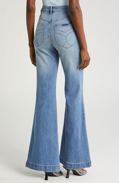 A high-rise waist and flared legs dial up the throwback charm of comfy organic cotton–blend jeans finished with a faded, vintage-inspired wash. 31" inseam, 24" leg opening; 11 1/2" front rise; 15 1/2" back rise (size 29) Zip fly with button closure Five-pocket style 99% organic cotton, 1% elastane Machine wash, line dry Imported Medium Wash High-waist Flares With Five Pockets, High Waist Medium Wash Flares With Five Pockets, High-rise Medium Wash Flares With Five Pockets, Retro High Rise Flare Jeans With Frayed Hem, Trendy Medium Wash Flares With Five Pockets, Light Wash Relaxed Fit Mid-rise Flare Jeans, High Rise Medium Wash Flares For Spring, Spring Medium Wash Wide Leg Flares, High Rise Cotton Flares In Medium Wash