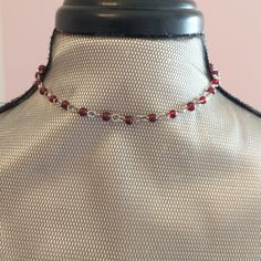 These retro style rosary chokers are ready to ship today. I make this choker with garnet red beads and high quality stainless steel. If you like boho chic, 90's or grunge styles, this could be just the choker for you.  I carry it in 4 wonderful colors. The beaded portion is about 12 inches long. Each has a 3 inch (7.5 cm) extender chain punctuated with either a teeny tiny heart or a teeny tiny star.  Like everything else here in HollysPrivateIdaho, they were made with love in a smoke-free home. Adjustable Red Beaded Chain Choker, Adjustable Red Beaded Choker, Grunge Chokers, 90s Grunge, Tiny Star, Tiny Heart, Red Bead, Red Garnet, Grunge Fashion