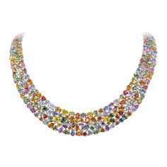 A stunning collar necklace, showcasing varying shapes and colors of vibrant sapphires weighing 161.55 carats total, set together seamlessly on 18K white gold. Accented by 14 small round brilliant cut diamonds weighing 0.80 carat total. An absolute work of art. Perfect for luxurious occasions. Roman Malakov is a custom house, specializing in creating anything you can imagine. If you would like to receive a special quote on a custom piece, please message or call us. Red Carpet Necklace, Stone Gold Necklace, Diamond Gold Necklace, Yellow Diamond Necklace, Sapphire Diamond Necklace, Wide Necklace, Colored Diamond Jewelry, Diamond Tops, Multi Coloured Necklaces