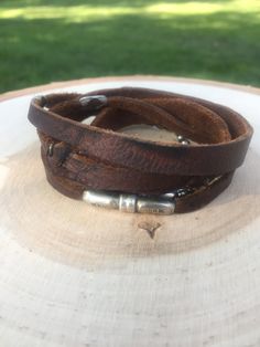 "Ready To Ship! 31\" Long Wrap, that when wrapped looks like a cuff. Models wrist (on video), is 5.75\" This is the Gunsmoke with a magnetic clasp. Random Branding throughout. Way Cool Bracelet! I can make this one a bit longer or shorter- just lmk if you purchase." Vintage Brown Wrap Bracelet Gift, Vintage Brown Wrap Bracelet, Vintage Handmade Adjustable Wristband, Handmade Adjustable Vintage Wristband, Handmade Vintage Adjustable Wristband, Vintage Adjustable Stackable Cuff Bracelet, Handmade Adjustable Vintage Wrap Bracelet, Vintage Adjustable Handmade Wrap Bracelet, Adjustable Brown Sterling Silver Bracelets