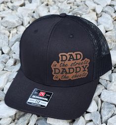 "This hat reads: \"DAD in the streets DADDY in the sheets\" and comes in a variety of colors and leatherette colors as well. The leatherette is secured with glue to make sure they stay on the hat so they are durable.  The hats are Richardson Brand FLEXFIT Hats but we also offer Snap Back here: https://www.etsy.com/listing/1568671511/dad-in-the-streets-daddy-in-the-sheets?ref=listings_manager_grid Details: Richardson FLEXFIT Hat Choice of colors (See pics) Hat is one size fits most. Leatherette p Cheap Trucker Hat For Father's Day With Curved Brim, Adjustable Trucker Hat With Leather Patch For Streetwear, Adjustable Leather Patch Trucker Hat For Streetwear, Adjustable Curved Brim Hat For Father's Day, Adjustable Urban Brown Hat, Adjustable Leather Hat For Streetwear, Father's Day Brown Curved Brim Hat, Father's Day Black Hat With Curved Brim, Black Curved Brim Hat For Father's Day