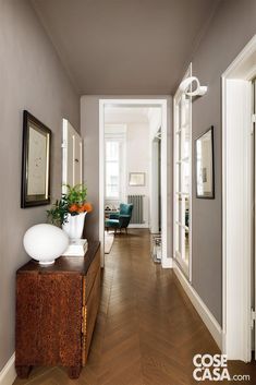 the hallway is clean and ready for guests to use it as an entrance way in this home