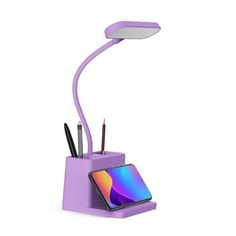 a purple desk lamp that is on top of a cell phone and pencils in it