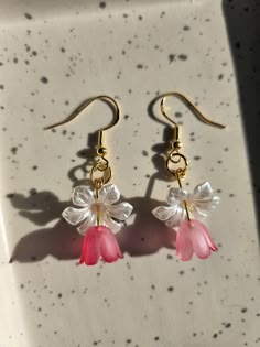 Delicate and charming, these flower earrings blossom with elegance. Crafted with intricate detail, each petal is a testament to nature's beauty, delicately suspended to sway with grace. Perfect for adding a touch of whimsy and femininity to any ensemble. And with our hypoallergenic silver plated posts you will be able to wear them comfortably ALL DAY! Spring 3d Flowers Dangle Earrings, Delicate Spring Jewelry With 3d Flowers, Whimsical Spring Flower Earrings With Ear Wire, Spring Flower Dangle Earrings, Dainty Spring Flower Earrings For Pierced Ears, Delicate Birth Flower Earrings, Dangle Flower Earrings With 3d Flowers, Whimsical Flower Earrings For Wedding, Spring Flower Earrings With Ear Wire