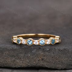 This is a beautiful blue topaz and moissanite ring in yellow gold. Perfect gift for Wedding,Christmas,Birthday,New Year:) The stones are 2.5mm blue topaz + moissanite The band is marked S925/G10K/G14K/PT950.(If you are allergic to nickel, we recommend Platinum) I accept custom making order, the stones can be changed. Please contact me if you need this service. All the jewelry in my store is handmade.It may take 2-3 weeks to finish. Friendly reminder: For special customized products do not accept Gold Blue Topaz Diamond Ring For Anniversary, Light Blue Diamond Ring For Wedding, Blue Diamond Half Eternity Ring For Wedding, Gold Aquamarine Anniversary Birthstone Ring, Gold Aquamarine Birthstone Ring For Anniversary, Blue Half Eternity Diamond Ring For Wedding, Blue Birthstone Ring With Diamond Accents For Wedding, Yellow Gold Topaz Ring For Wedding, Yellow Gold Topaz Wedding Ring