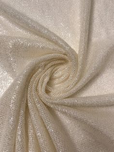 a white fabric that is very soft and shiny