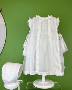 A delicate dress and bonnet made in white organza with pleats and laces. The dress has two ribbon bows on the sides, and buttons on the back for closure. Made in Spain Dry clean Final sale, no exchanges nor returns are available White Baptism Dress, Baptism Dresses, Delicate Dress, Christening Dresses, Dress For Baby Girl, Spanish Fashion, Dress For Baby, Baptism Dress, Christening Dress