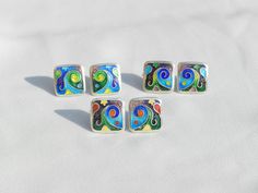 The advantages of the cloisonne enamel earrings: 🔷 it is lightweight 🔷 100 % handmade 🔷 is unique, one of a kind 🔷 reasonable size and weight allows you to wear every day 🔷 matches with different types of outfits - dresses and pants as well 🔷 May be a perfect gift for people who love handmade gifts ... This artwork earrings are 100 % handmade by me in my studio. The technique is called Cloisonne enamel which is well known in Georgia. Cloissone is using tiny metal strips to make a pattern then putting powder enamel into the spaces to make a design. Then it is heated in a kiln until the powder becomes glass. Cloisonne enamel is such a delicate art form... Many people in my country love buying handmade cloisonne enamel jewelry because they are unique and special!  DIMENSIONS: 0.5 X 0.5 Artistic Enamel Jewelry For Formal Occasions, Green Enamel Earrings With Artistic Design, Green Enamel Clip-on Earrings As Gift, Enamel Earrings With Artistic Design For Gift, Artistic Enamel Earrings For Gifts, Unique Enamel Earrings For Gift, Black Enamel Earrings For Gift, Handmade Enamel Earrings For Formal Occasions, Silver Enamel Pin For Gift