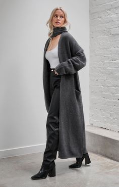 Effortless luxury with an edge. Upgrade your winter wardrobe with Merino Cashmere essentials. This supremely soft, oversized throw over merges warmth with versatility and style, ready to elevate your weekend look. Pair with Luxe Rib™ Basics and Vegan Pebbled™. 80% merino wool | 15% cashmere | 5% nylon Super warm with soft hand feel Natural fibres that are light-weight, allow breathability and regulate temperature A touch of nylon to help retain shape and longevity Dropped shoulder for relaxed fi Cozy Long Sweater Coat For Cold Weather, Chic Gray Sweater Coat For Fall, Cozy Long Coat Sweater For Layering, Classic Long Sweater Coat For Fall, Chic Oversized Long Sleeve Sweater Coat, Oversized Winter Sweater Coat In Solid Color, Oversized Solid Color Winter Sweater Coat, Oversized Solid Color Sweater Coat For Winter, Wool Outerwear For Winter