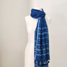 The softest cotton in the deepest indigo blue. Small jamdani-weave details in cotton and raw silk, with ikat-ish stripes at each end. handwoven and naturally dyed cotton with silk details 26.5 x 92 inches Jamdani handloom textiles are woven by hand, by master craftspeople, without the use of electricity. Designs are woven into the fabric while it is on the loom. Each piece is individually hand-crafted. Care: hand wash gently in cool water, line dry in shade. Blue Cotton Handloom Dupatta, Bohemian Indigo Cotton Dupatta, Traditional Cotton Scarf With Natural Dye, Traditional Cotton Scarves With Natural Dye, Indigo Handloom Cotton Dupatta, Indigo Cotton Handloom Dupatta, Handloom Cotton Indigo Dupatta, Handloom Cotton Dupatta In Indigo, Bohemian Blue Handloom Dupatta