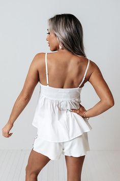 Our adorable white 'Lovely Story' tank is the upgrade your wardrobe has been asking for with its lightweight material, square neckline with adjustable spaghetti straps, and flattering figure hugging bodice that falls into a flirty babydoll silhouette with a straight hemline! Distressed Pants, Babydoll Tank, Model Fits, Bad Girl, Hip Length, Square Neckline, High Waisted Shorts, Online Womens Clothing, Distressed Jeans