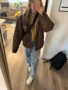 Long Sleeve Carhartt Shirt Outfit, How To Style Carhartt Jacket, Outfits With Carhartt Vest, Carhartt Carpenter Pants Outfit, Fall Jackets Aesthetic, Brown Carhartt Jacket Outfit Women, Granola College Outfits, Oversized Longsleeves Outfit, Women’s Beanie Outfit