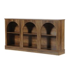 a wooden bookcase with three shelves and arches on the front, against a white background