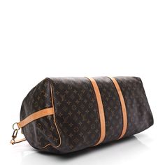 This is an authentic LOUIS VUITTON Monogram Keepall Bandouliere 55. This bag is crafted of signature Louis Vuitton monogram coated canvas. The bag features a vachetta cowhide leather trim, rolled top handles, an optional shoulder strap, and gold hardware. The top zippers open the bag to a spacious cocoa brown fabric interior. Cocoa Brown, Brown Fabric, Leather Trim, Authentic Louis Vuitton, Cowhide Leather, Leather Trims, Gold Hardware, Louis Vuitton Monogram, Cocoa