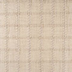 an upholstered beige fabric textured with small squares and lines in varying sizes