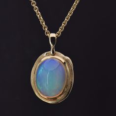 Details: 18k Yellow Gold Opal, 7.61 carat total weight Measurements: 20" chain included Finely crafted in New York, New York. Audrius Krulis' Biography & Collection can be found here. Please contact us for resizing options, special order inquiries, or any other questions. Classic Yellow Gold Necklaces With Cabochon, Formal Cabochon Pendant Necklace, 14k Gold Oval Link Necklace Hallmarked, Exquisite Yellow Gold Jewelry With Large Pendant, Antique Yellow Gold Necklace With Cabochon, Luxury Oval Pendant Necklace For Collectors, Collectible 14k Gold Gemstone Necklace, Formal Custom Necklace In 14k Gold With Polished Finish, Formal Timeless Jewelry With Large Pendant