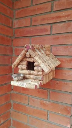 a bird house made out of wine corks