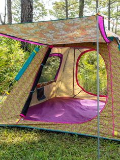 a tent is set up in the woods